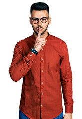 Young hispanic man with beard wearing business shirt and glasses asking to be quiet with finger on lips. silence and secret concept.