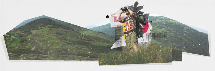 Young man with backpacks standing on mountain and looking in binoculars against nature background....