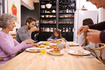 Breakfast, family home and grandparents with kitchen table and conversation with love and weekend break. Parents, food and senior people eating meal together with joy, social gathering and nutrition