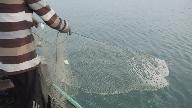 From their traditional boats, fishermen pull nets with almost no catch. It's tough out there. Pollution and overfishing make it hard to find fish. 