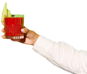Lady's hand holding glass of Bloody Mary decorated with vegetable slices against transparent...