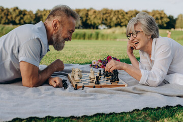 Carefree old couple enjoying leisure activities on fresh air  - 767884824