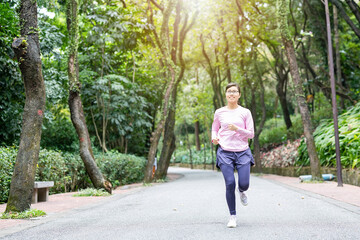 Woman exercising and jogging in park