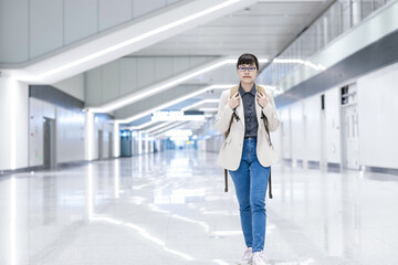 Commuter white-collar workers walking at subway station