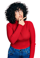 Young middle east girl wearing casual clothes and glasses thinking worried about a question, concerned and nervous with hand on chin