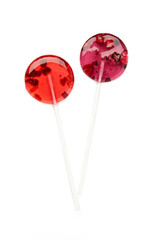Colorful sweet lollipops with berries isolated on white background. Vertical photo
