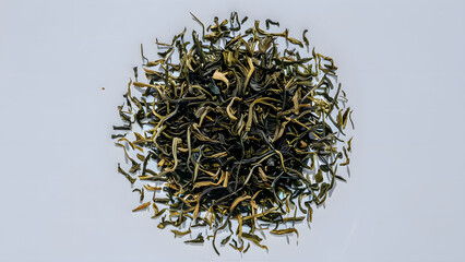 Dry tea leaves on white background.