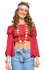Young blonde girl wearing bohemian and hippie style looking positive and happy standing and smiling with a confident smile showing teeth