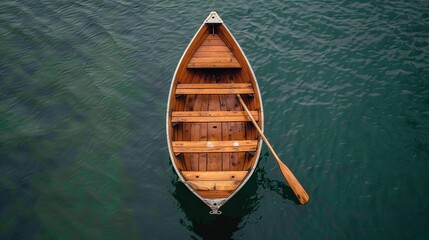 Wooden boat, seen from above, floating on water