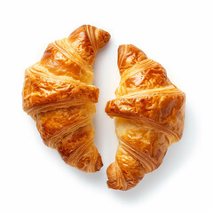 Two croissants lie side-by-side on a clean white background