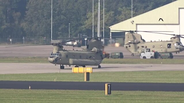 Military Army Transport Helicopters Taxiing Preparing prior take off taking off at air base airport airfield prior a mission evacuation air bridge.