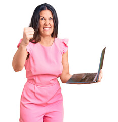 Young beautiful brunette woman working using laptop annoyed and frustrated shouting with anger,...