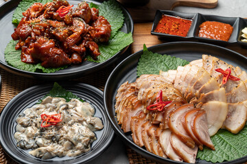 Korean food, pig's feet, spicy, bossam, pork, boiled pork, oysters, side dishes, kimchi, cabbage,...