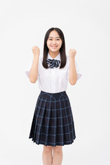 制服を着た日本人女子高校生/ガッツポーズ/白背景スタジオ撮影	