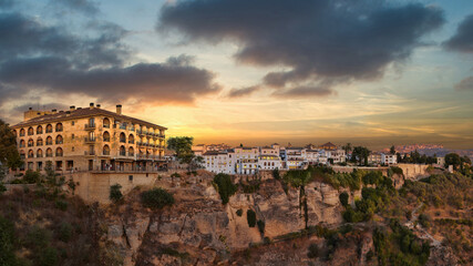 Scenic view of the town of Ronda in Malaga at golden sunset - obrazy, fototapety, plakaty