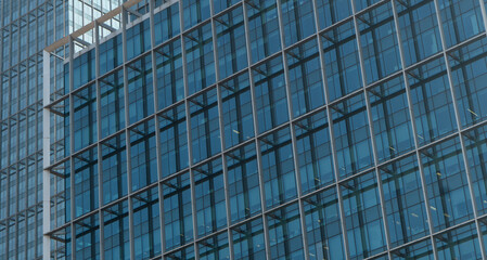 Obraz premium Modern office buildings in the financial district. Office buildings. glass buildings background. Windows of Skyscraper. Business Office. Corporate building