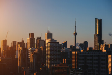 sunset over Toronto city downtown skyline, sunrise over CN Tower and skyscrapers of financial district Canada