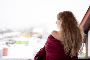 Portrait of a young woman wrapped in a blanket	