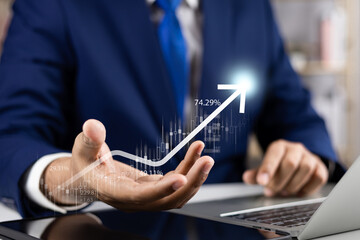 Businessman using tablet and laptop analyzing sales data economic growth graph chart strategic...
