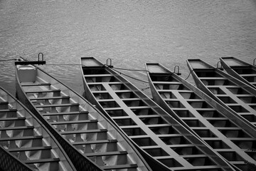 Boats docked by the bank of a river