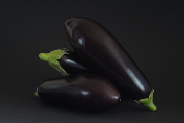 Aubergines,egplants on dark backgound,vegetable,healthy food,vegan, cooking concept, Low key image with free copy space. - 767927062
