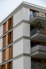 Exterior of a modern apartment complex with small balconies