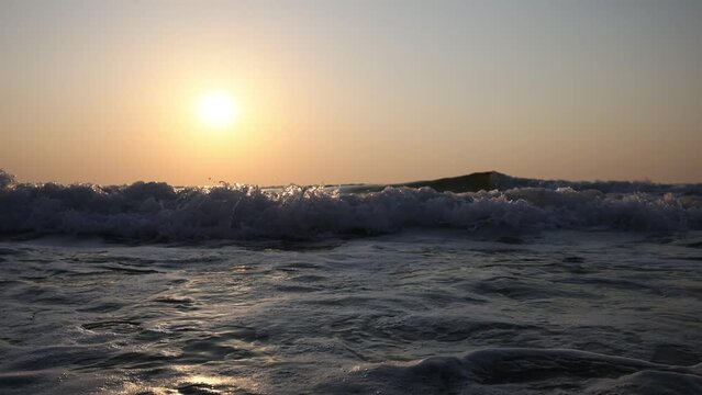 View of big sea waves at sunset, for wallpaper
