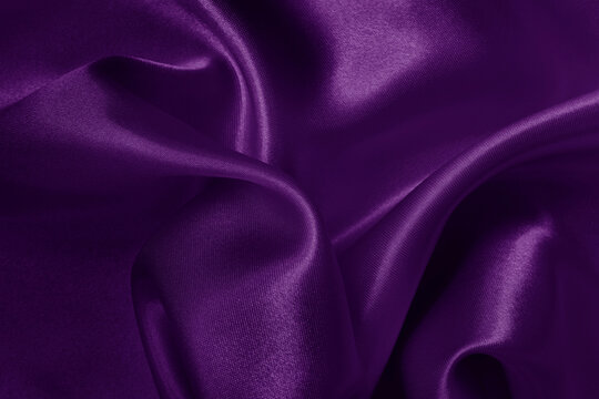 Purple fabric cloth texture for background and design art work, beautiful crumpled pattern of silk or linen.