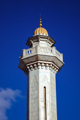 Fototapeta na wymiar One of the minarets of Mausoleum of Habib Bourguiba in Monastir coastal city, Sahel area, Tunisia