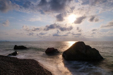 Obraz premium Water waves of the Black Sea crashing on rocks on the stony shore, coast - close up, nobody, no people. Nature, element, landscape