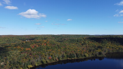 Naklejka na ściany i meble Northern Ontario Canada by drone photography during the fall showing the beautiful fall colors. 