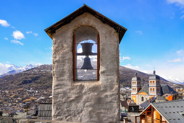 Belfry in front of the Collegiate Church of Our Lady and Saint Nicholas of Briançon in the fortified old town built by Vauban in the French Alps - obrazy, fototapety, plakaty