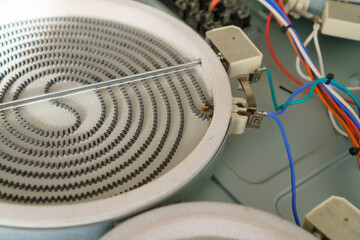 Close-up The induction hob needs repair, the heater is burnt out. stove repair in the kitchen .