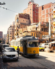 14 06 2023 Alexandria, Egypt, the streets of an ancient African city filled with people and trams. This was on a hot sunny summers day. - obrazy, fototapety, plakaty