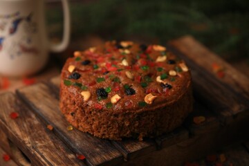 Christmas cake ,plum cake served on a table closeup with selective focus and blur