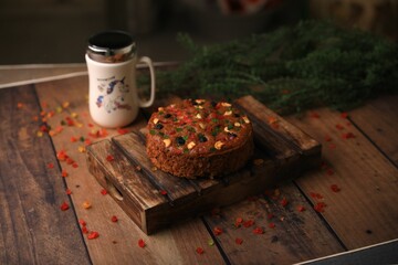 Christmas cake ,plum cake served on a table closeup with selective focus and blur