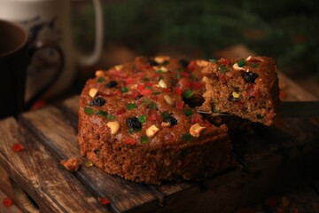 Christmas cake ,plum cake served on a table closeup with selective focus and blur