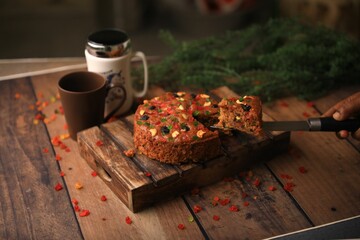 Christmas cake ,plum cake served on a table closeup with selective focus and blur