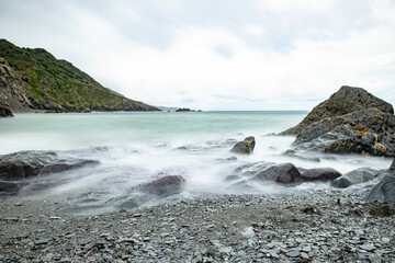 Scenic view of the rocky shoreline along Tunnels Beaches in Ilfracombe, England with a stunning view © Wirestock