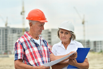 Fototapeta premium Portrait of senior couple in under construction