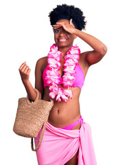 Young african american woman wearing bikini and hawaiian lei stressed and frustrated with hand on...