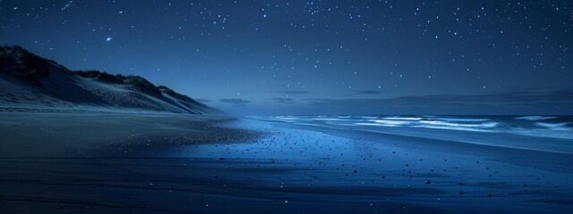 A calm, starry night sky over a deserted beach, with a faint glow of northern lights.