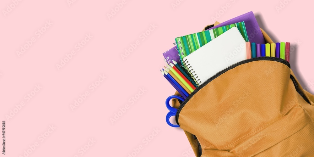 Sticker School backpack and colored stationery on desk