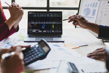 Business meeting, Financial consultants discuss investment growth chart analysis in company...