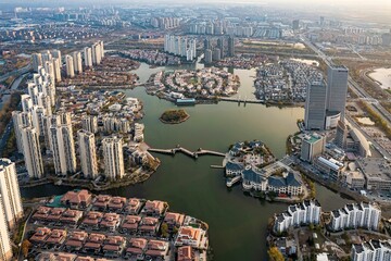Aerial view of an urban landscape featuring an array of tall modern buildings near the lake