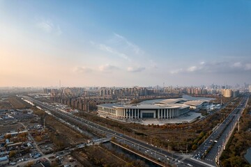 Aerial shot of Tianjin Meijiang Convention and Exhibition Center, China at sunset