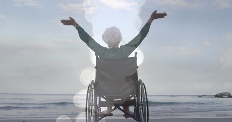 Image of light spots over disabled caucasian woman with arms outstretched