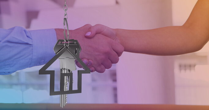 Image of keys and house icon over diverse people shaking hands