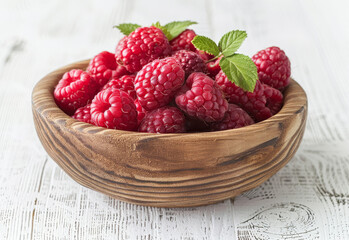 Fresh raspberries in wooden bowl