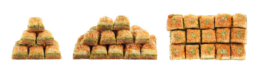 Eastern sweets. Pieces of delicious fresh baklava with chopped nuts isolated on white, set